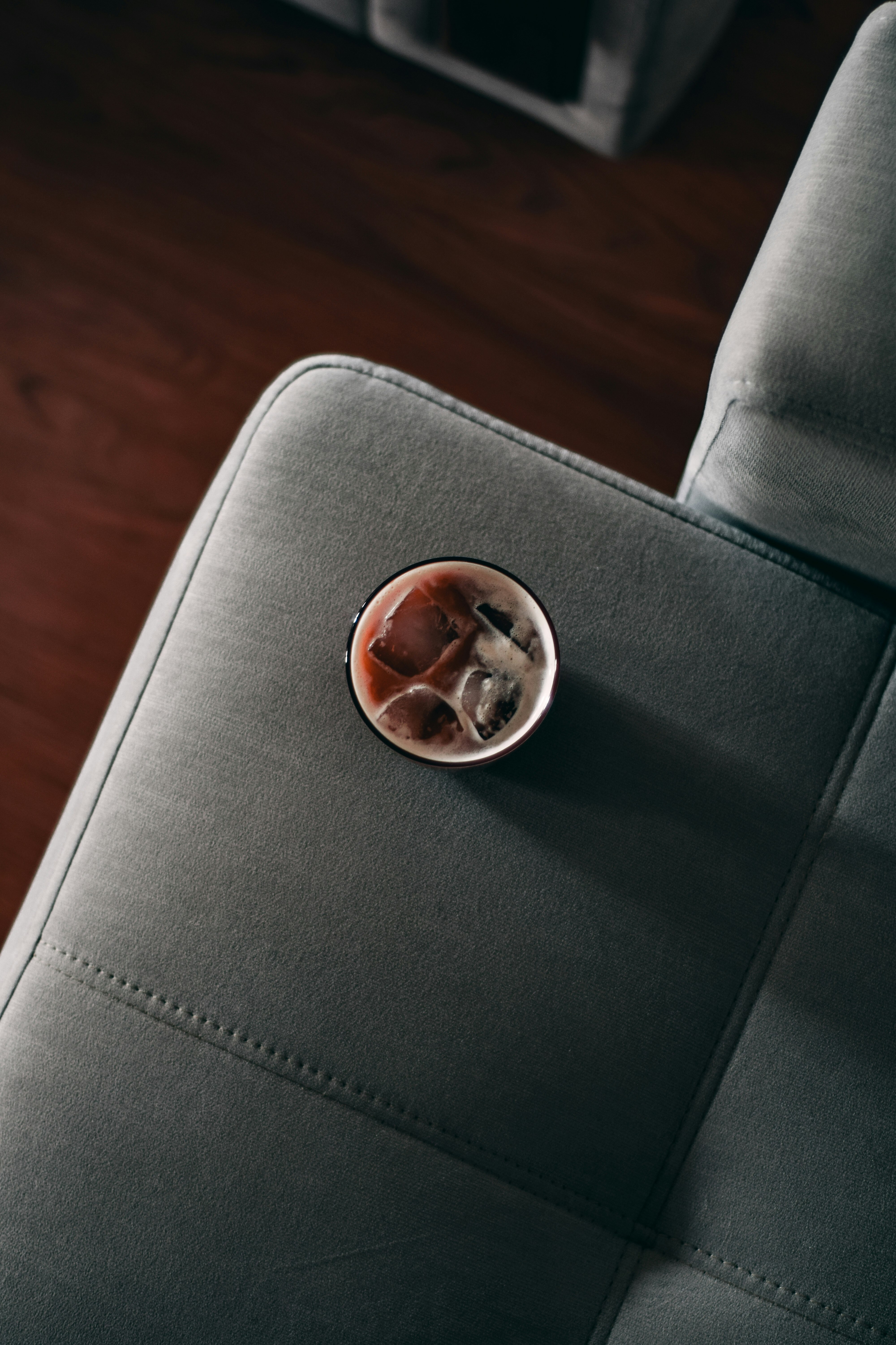 silver round coin on black leather chair
